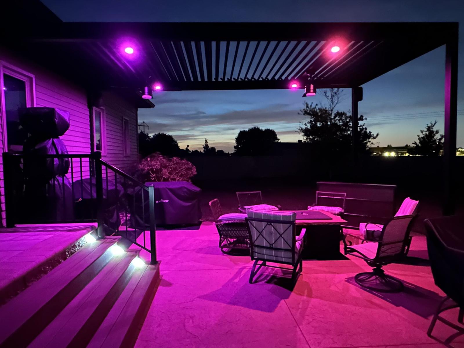 TiDAL-X pergola at dusk with JellyFish color lighting on the patio