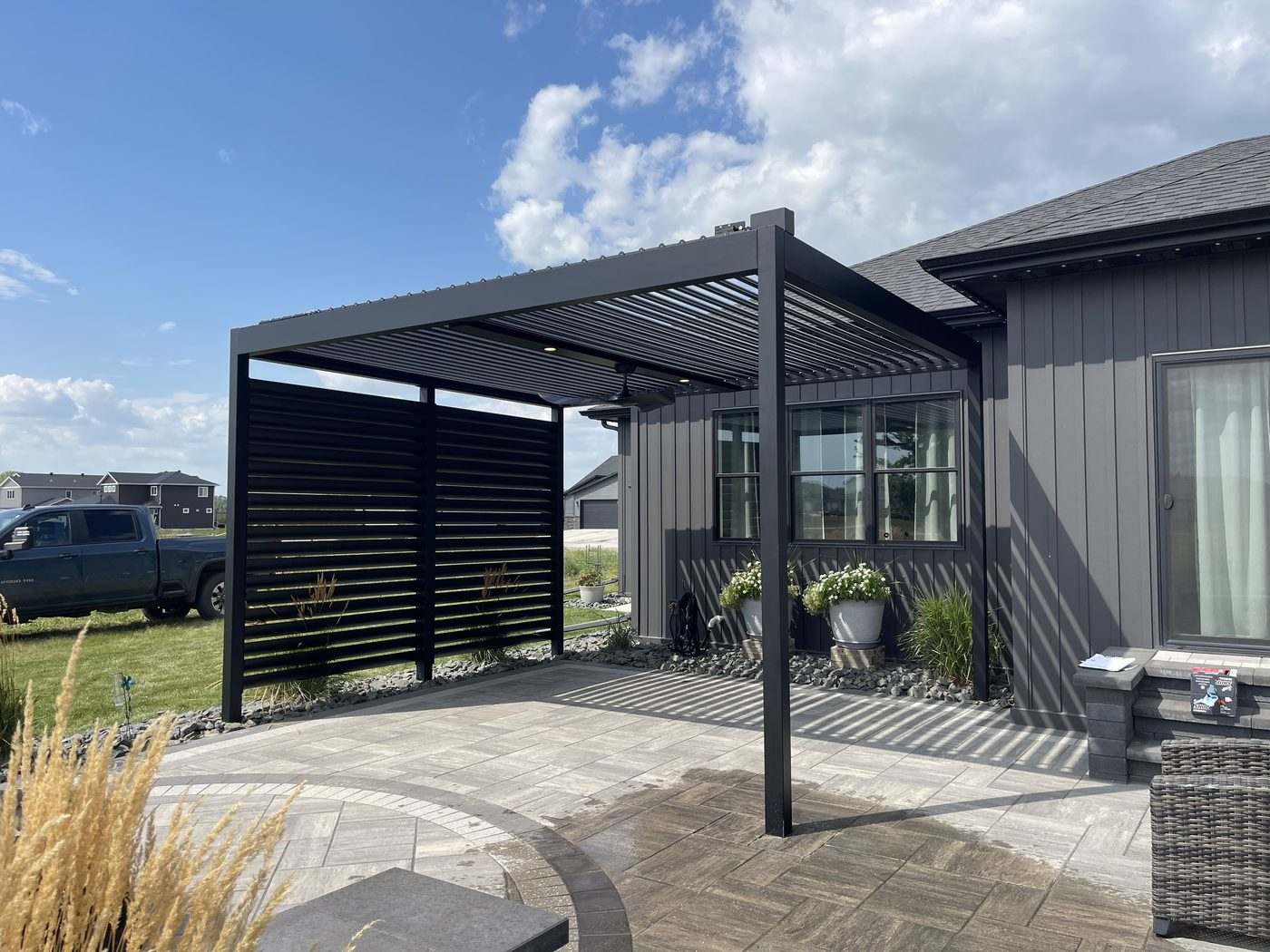 Powder-coated aluminum pergola and louvered screen wall